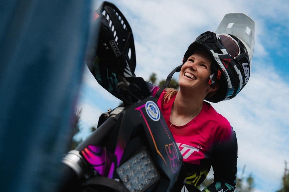 Portrait of Carolyn in riding gear.