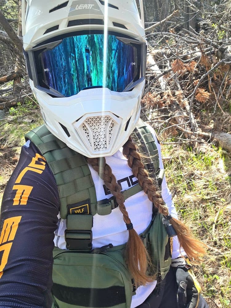 Portrait of Kristin in riding gear.